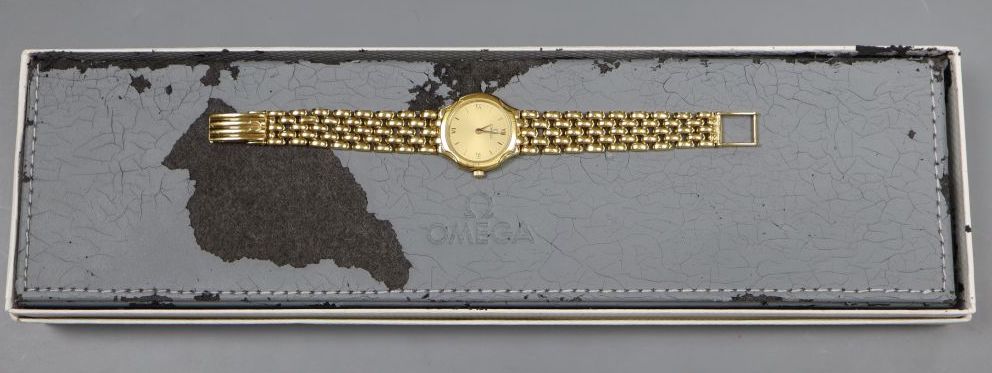 A ladys 1990s 18ct gold Omega quartz wrist watch on Omega 18ct gold bracelet,